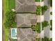 Overhead aerial view with a pool, backyard, and neighboring houses showcasing a lakefront community at 1613 Water Elm Ct, Orlando, FL 32825