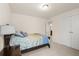 Bedroom with neutral walls, plush carpeting, a full bed, and an ensuite bathroom at 1613 Water Elm Ct, Orlando, FL 32825