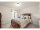 Comfortable bedroom featuring a well-made bed, soft carpet, and a window with natural light at 1613 Water Elm Ct, Orlando, FL 32825
