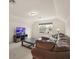 Bonus room with modern furnishings, including a sectional sofa and entertainment center at 1613 Water Elm Ct, Orlando, FL 32825