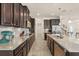 Gourmet kitchen with long countertops, stainless steel appliances, and ample cabinet space at 1613 Water Elm Ct, Orlando, FL 32825