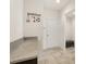 Mud room with granite countertops and plenty of storage, a door leading outside, and tile floors at 1613 Water Elm Ct, Orlando, FL 32825