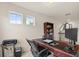 Office featuring a modern desk setup, complemented by bright natural light and essential work equipment at 1613 Water Elm Ct, Orlando, FL 32825