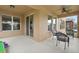 Covered outdoor patio includes ceiling fan and seating area, perfect for relaxing or entertaining at 1613 Water Elm Ct, Orlando, FL 32825