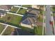 Aerial view of a backyard with solar panels and white fencing in a residential neighborhood at 171 Seville Dr, Davenport, FL 33837