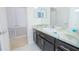 Bathroom featuring a vanity with sink and blue-accented countertop with additional storage at 171 Seville Dr, Davenport, FL 33837