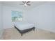 Neutral bedroom with carpet, ceiling fan, and window providing natural light at 171 Seville Dr, Davenport, FL 33837