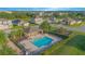 Community pool with playground, lounge chairs, tables and a covered area, perfect for recreation and enjoyment at 171 Seville Dr, Davenport, FL 33837