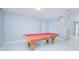 Game room featuring a red felt pool table and neutral wall paint at 171 Seville Dr, Davenport, FL 33837