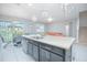 Open concept kitchen with stainless steel appliances, a breakfast bar, and dining area at 171 Seville Dr, Davenport, FL 33837