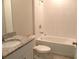 Bathroom featuring a granite countertop vanity, tile floors, and a shower-tub combo at 17305 Cagan Crossings Blvd, Clermont, FL 34714