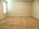 Expansive bedroom offering neutral carpet and bright, natural light at 17305 Cagan Crossings Blvd, Clermont, FL 34714