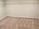 Spacious walk-in closet with wire shelving for ample storage in the home at 17305 Cagan Crossings Blvd, Clermont, FL 34714