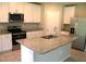 Kitchen featuring granite countertops, stainless steel appliances, and white cabinets at 17305 Cagan Crossings Blvd, Clermont, FL 34714