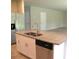 Kitchen island with granite countertop, stainless steel sink, and stainless steel dishwasher at 17305 Cagan Crossings Blvd, Clermont, FL 34714