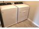 Well-lit laundry room with a Whirlpool washer and dryer, ready for convenience at 17305 Cagan Crossings Blvd, Clermont, FL 34714