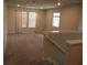 Upper level living room featuring carpeted floors and lots of natural light at 17305 Cagan Crossings Blvd, Clermont, FL 34714