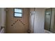 Full bathroom with tiled shower and decorative geometric trim at 2008 Juniper Dr, Edgewater, FL 32141