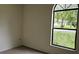 Bright bedroom featuring a large window providing ample natural light and an outside view at 2008 Juniper Dr, Edgewater, FL 32141