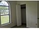 Bright bedroom featuring a window and closet at 2008 Juniper Dr, Edgewater, FL 32141