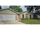 Charming single-Gathering home with a two-car garage and stone accents at 2008 Juniper Dr, Edgewater, FL 32141