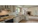 Classic kitchen with vintage cabinets and stove, open to the living area at 2008 Juniper Dr, Edgewater, FL 32141