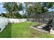 Well-maintained backyard with green grass, a privacy fence, a view of the pool, and adirondack seating at 207 Ramsbury Ct, Longwood, FL 32779