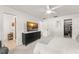 White bedroom featuring a dresser with television, and sliding closet doors at 207 Ramsbury Ct, Longwood, FL 32779