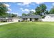 Charming single-story home with an attached garage, manicured lawn, and front landscaping at 207 Ramsbury Ct, Longwood, FL 32779