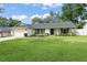 Charming home with a well-manicured lawn, lovely landscaping, and attached two-car garage at 207 Ramsbury Ct, Longwood, FL 32779