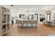 Beautiful kitchen with white cabinets, stainless steel appliances, and a large center island with bar seating at 207 Ramsbury Ct, Longwood, FL 32779