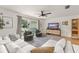 Bright living room with a large window and modern furniture at 207 Ramsbury Ct, Longwood, FL 32779