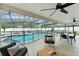 Screened-in pool with patio seating and dining area at 207 Ramsbury Ct, Longwood, FL 32779