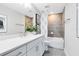 Modern bathroom featuring gray backsplash, tiled floors, white vanity and shower-tub combo at 2267 Mossy Vine Ave, St Cloud, FL 34771