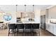 Bright kitchen featuring an island with pendant lights and stainless steel appliances at 2267 Mossy Vine Ave, St Cloud, FL 34771