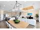 Inviting living area with an elegant chandelier, tv and a staircase to the upper level at 2267 Mossy Vine Ave, St Cloud, FL 34771