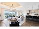 Open-concept living space featuring a modern chandelier, stylish furniture, and sliding doors to the outdoor space at 2267 Mossy Vine Ave, St Cloud, FL 34771