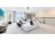 Upstairs loft area featuring a cozy seating area with modern decor, a TV, and large windows at 2267 Mossy Vine Ave, St Cloud, FL 34771