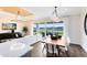 Open-concept living and dining area with modern lighting, decor, and lake views at 2267 Mossy Vine Ave, St Cloud, FL 34771
