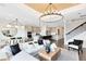 Inviting living area with an open layout, featuring a dining area, kitchen, and staircase at 2267 Mossy Vine Ave, St Cloud, FL 34771