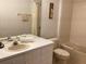 Bright bathroom featuring a shower and tub, vanity with sink, and toilet at 2305 Butterfly Palm Way # 304, Kissimmee, FL 34747