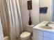Well lit bathroom featuring a tub/shower, vanity with sink, toilet, and neutral accents at 2305 Butterfly Palm Way # 304, Kissimmee, FL 34747