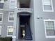 Exterior of building with staircase leading to units at 2305 Butterfly Palm Way # 304, Kissimmee, FL 34747