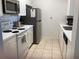 Well-equipped kitchen features modern appliances and ample counter space at 2305 Butterfly Palm Way # 304, Kissimmee, FL 34747