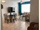 Bright living room with tile flooring, comfortable seating, and a large TV at 2305 Butterfly Palm Way # 304, Kissimmee, FL 34747
