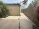 Private backyard featuring a concrete patio and well-maintained fence, ideal for outdoor gatherings at 2500 21St Nw St # 58, Winter Haven, FL 33881