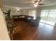 Living room with hardwood floors, ceiling fans and sliding glass doors at 2500 21St Nw St # 58, Winter Haven, FL 33881