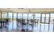 Light filled meeting room with floor-to-ceiling windows providing stunning lake views at 2500 21St Nw St # 58, Winter Haven, FL 33881