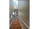 Bright staircase leading up to the entrance with a tall window offering natural light and pleasant views at 2500 21St Nw St # 58, Winter Haven, FL 33881