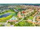 Scenic aerial view of a resort community with a pool and lush green spaces, perfect for relaxation and recreation at 2821 Almaton Loop # 105, Kissimmee, FL 34747